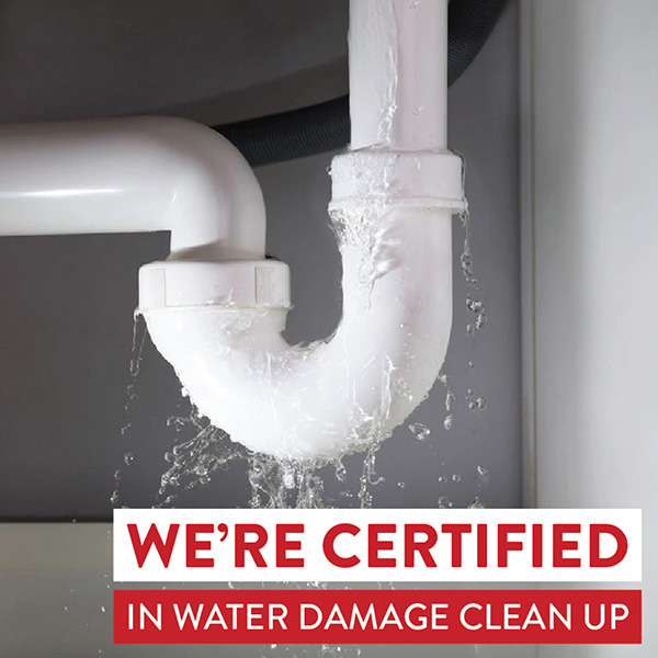 photo of leaking pipe under sink with we're certified in water damage cleanup over it
